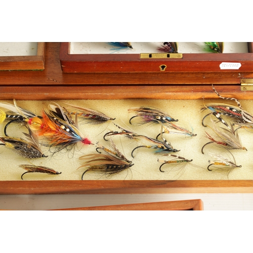 599 - A COLLECTION OF FOUR CASES CONTAINING VARIOUS VINTAGE SALMON FISHING FLIES (longest box measures 66c... 