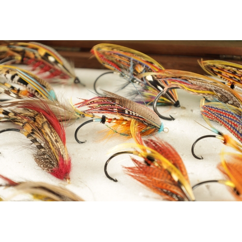 599 - A COLLECTION OF FOUR CASES CONTAINING VARIOUS VINTAGE SALMON FISHING FLIES (longest box measures 66c... 