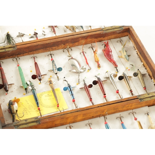 607 - A COLLECTION OF VINTAGE FISHING LURES AND MODERN SPINNERS in various cases and boxes.