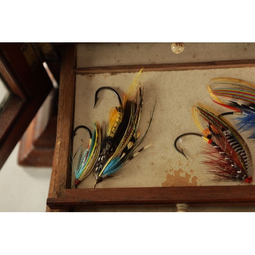 609 - A LATE 19TH CENTURY TABLE CABINET CONTAINING VARIOUS FISHING SALMON FLIES the mahogany cabinet with ... 