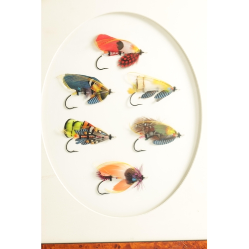 619 - THREE FRAMED WALL MOUNTED DISPLAYS OF SLAMON FISHING FLIES the pair inscribed on reverse 