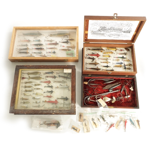 630 - A LARGE COLLECTION OF VINTAGE FISHING LURES mostly displayed in glazed cases and boxes by Hardy and ... 