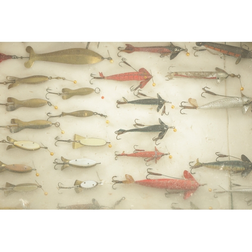 630 - A LARGE COLLECTION OF VINTAGE FISHING LURES mostly displayed in glazed cases and boxes by Hardy and ... 