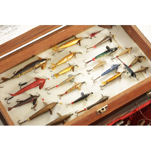 630 - A LARGE COLLECTION OF VINTAGE FISHING LURES mostly displayed in glazed cases and boxes by Hardy and ... 