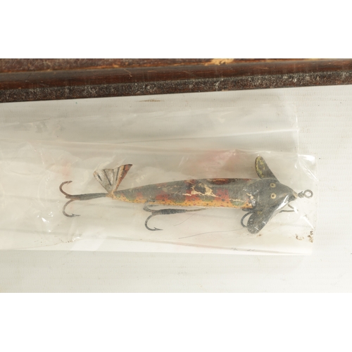 630 - A LARGE COLLECTION OF VINTAGE FISHING LURES mostly displayed in glazed cases and boxes by Hardy and ... 