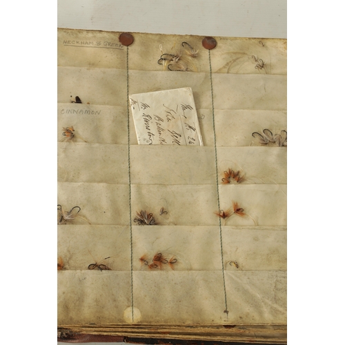 632 - A 19TH CENTURY LEATHER BOUND BOOK CONTAINING VARIOUS TROUT FISHING FLIES, each page having velum poc... 