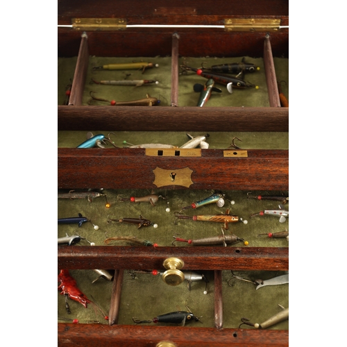 640 - A VINTAGE FISHING TACKLE BOX CONTAINING VARIOUS LURES with graduated drawers and hinged lid. (27cm h... 