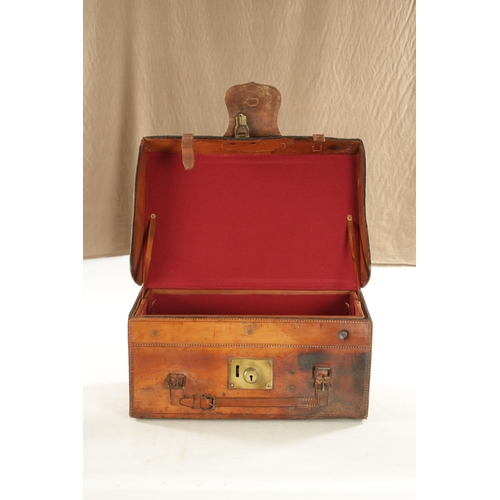 654 - A LARGE 19TH CENTURY LEATHER FISHING BOX BY HARDY BROS. with tooled leather decoration and brass loc... 