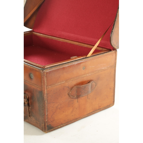 654 - A LARGE 19TH CENTURY LEATHER FISHING BOX BY HARDY BROS. with tooled leather decoration and brass loc... 