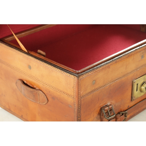 654 - A LARGE 19TH CENTURY LEATHER FISHING BOX BY HARDY BROS. with tooled leather decoration and brass loc... 