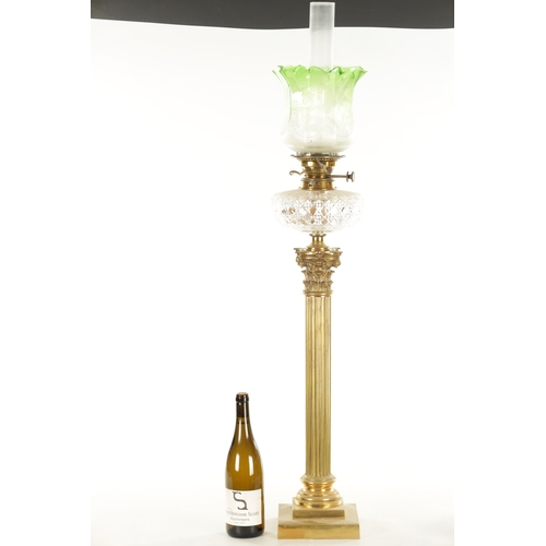 666 - A 19TH CENTURY BRASS CORINTHIAN COLUMN OIL LAMP with a glass tinted-shaped glass shade and cut glass... 