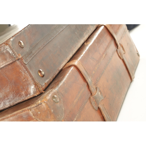 680 - TWO VINTAGE LEATHER SUITCASES (The larger measures 71cm wide)