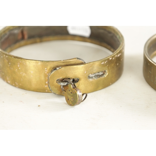 684 - TWO SIMILAR GEORGE III BRASS AND LEATHER DOG COLLARS inscribed J. R. Clapham AUSTWICK HALL (Yorkshir... 