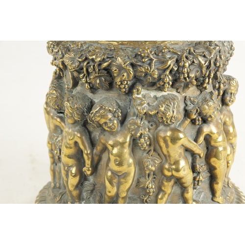 686 - A 19TH CENTURY BRONZE PEDESTAL modelled with cherubs amongst grape vines. (21cm high )