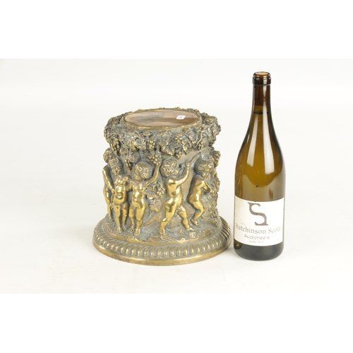 686 - A 19TH CENTURY BRONZE PEDESTAL modelled with cherubs amongst grape vines. (21cm high )