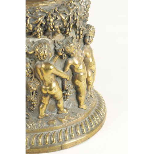 686 - A 19TH CENTURY BRONZE PEDESTAL modelled with cherubs amongst grape vines. (21cm high )