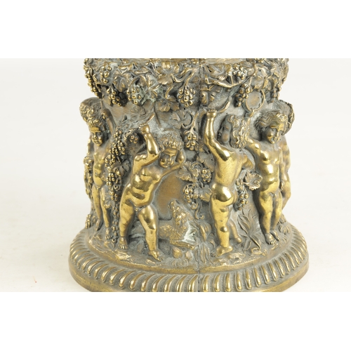 686 - A 19TH CENTURY BRONZE PEDESTAL modelled with cherubs amongst grape vines. (21cm high )