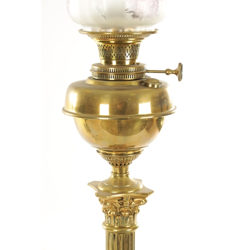 689 - A 19TH CENTURY BRASS CORINTHIAN COLUMN OIL LAMP with yellow tinted glass shade and solid brass reser... 