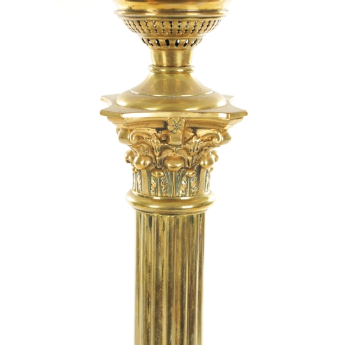 689 - A 19TH CENTURY BRASS CORINTHIAN COLUMN OIL LAMP with yellow tinted glass shade and solid brass reser... 