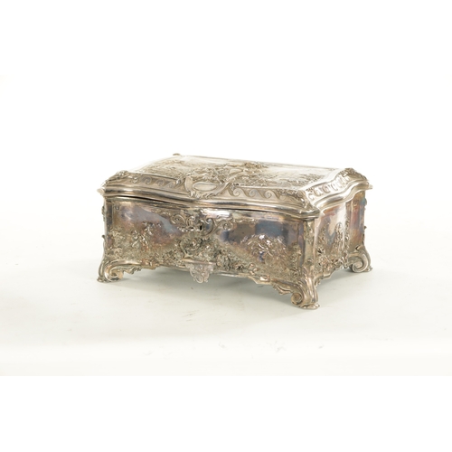 694 - A 19TH CENTURY SILVER PLATED ROCOCO STYLE CASKET decorated with cherubs, stamped Walker and Hall, Sh... 