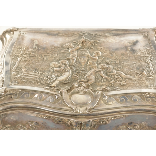 694 - A 19TH CENTURY SILVER PLATED ROCOCO STYLE CASKET decorated with cherubs, stamped Walker and Hall, Sh... 