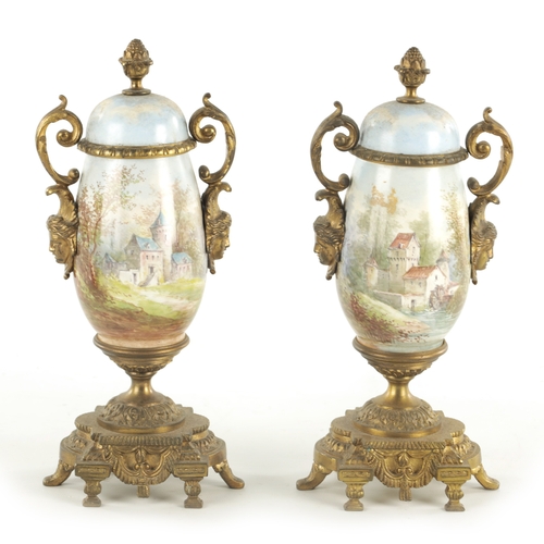 696 - A PAIR OF LATE 19TH CENTURY PORCELAIN AND ORMOLU MOUNTED URNS (25cm high )