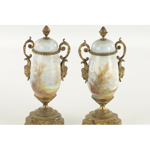 696 - A PAIR OF LATE 19TH CENTURY PORCELAIN AND ORMOLU MOUNTED URNS (25cm high )