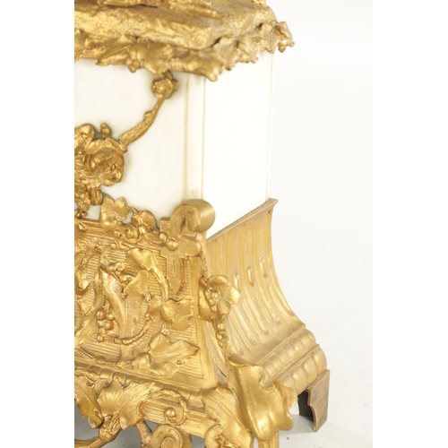 793 - A 19TH CENTURY FRENCH ORNATE GILT METAL AND WHITE MARBLE MANTEL CLOCK OF LARGE SIZE with figural top... 