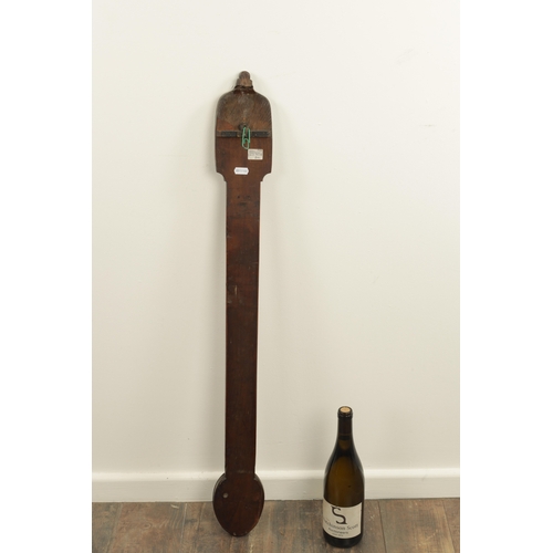 801 - AN 18TH CENTURY PROVINCIAL WALNUT STICK BAROMETER with calibrated brass dials (92cm high )