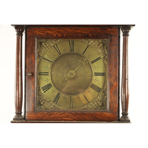 812 - A SMALL 18TH CENTURY 30-HOUR LONGCASE CLOCK the slender oak case with shaped door and turned pillars... 