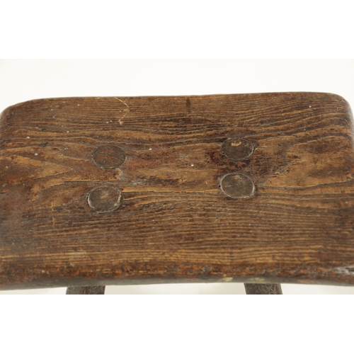 820 - A 19TH CENTURY PRIMITIVE ASH STOOL with a stumbled stick base (29cm wide 20cm deep 24cm high )