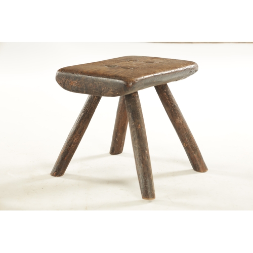 820 - A 19TH CENTURY PRIMITIVE ASH STOOL with a stumbled stick base (29cm wide 20cm deep 24cm high )