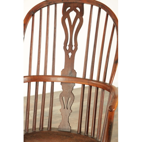 821 - A 19TH CENTURY HIGH BACK YEW-WOOD WINDSOR CHAIR with a pierced splat back and elm saddle seat on tur... 