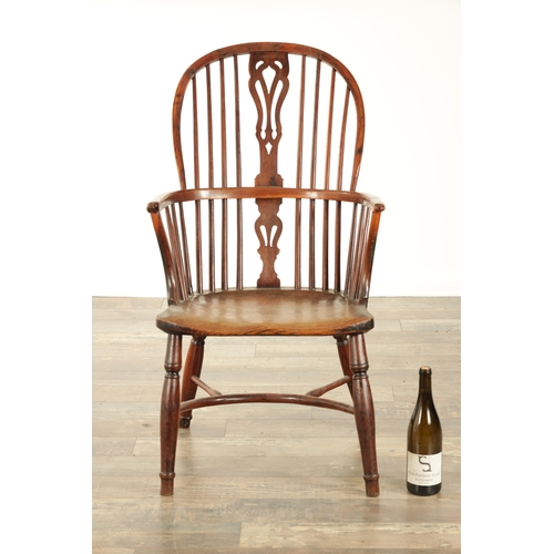 821 - A 19TH CENTURY HIGH BACK YEW-WOOD WINDSOR CHAIR with a pierced splat back and elm saddle seat on tur... 