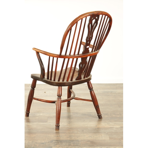 821 - A 19TH CENTURY HIGH BACK YEW-WOOD WINDSOR CHAIR with a pierced splat back and elm saddle seat on tur... 