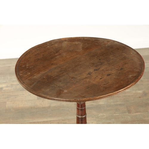 823 - A GEORGE III OAK CIRCULAR TILT TOP TRIPOD TBALE with a revolving bird cage on a ringed turned stem (... 