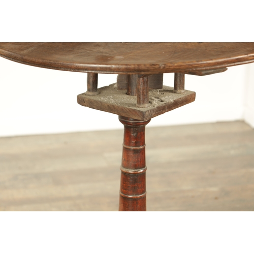 823 - A GEORGE III OAK CIRCULAR TILT TOP TRIPOD TBALE with a revolving bird cage on a ringed turned stem (... 