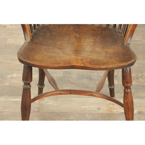 826 - AN EARLY 19TH CENTURY LOW BACK YEW WOOD WINDSOR CHAIR with pierced slat back, saddle seat with turne... 