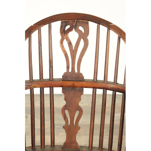 826 - AN EARLY 19TH CENTURY LOW BACK YEW WOOD WINDSOR CHAIR with pierced slat back, saddle seat with turne... 