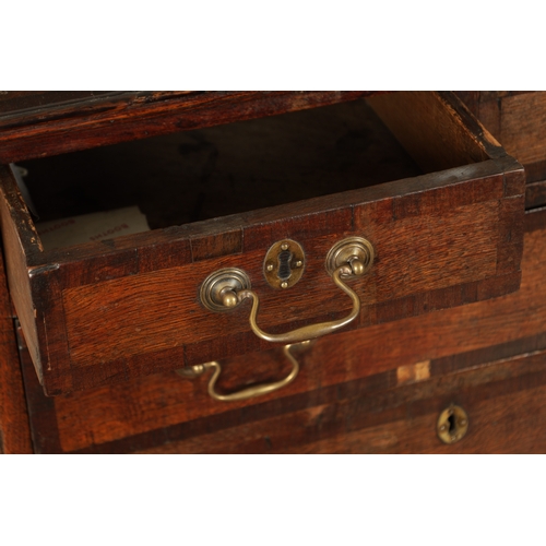 829 - A SMALL GEORGE III OAK AND WALNUT CROSS-BANDED CHEST OF DRAWERS with two small and three long gradua... 