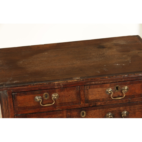 829 - A SMALL GEORGE III OAK AND WALNUT CROSS-BANDED CHEST OF DRAWERS with two small and three long gradua... 