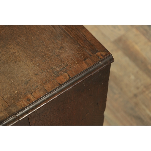 832 - A SMALL EARLY GEORGE III OAK CHEST OF DRAWERS with cross-banded top above two small and three long g... 