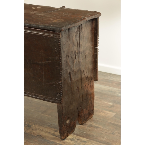 834 - A LARGE EARLY 17TH CENTURY OAK SIX PLANK COFFER of unusually large size having ironwork strap hinges... 