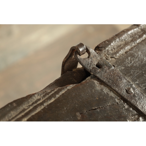 834 - A LARGE EARLY 17TH CENTURY OAK SIX PLANK COFFER of unusually large size having ironwork strap hinges... 