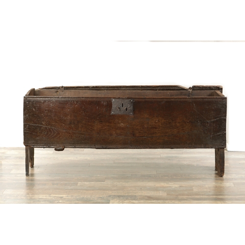 834 - A LARGE EARLY 17TH CENTURY OAK SIX PLANK COFFER of unusually large size having ironwork strap hinges... 