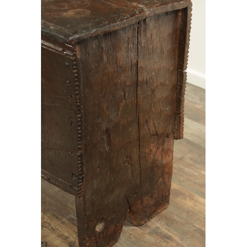 834 - A LARGE EARLY 17TH CENTURY OAK SIX PLANK COFFER of unusually large size having ironwork strap hinges... 