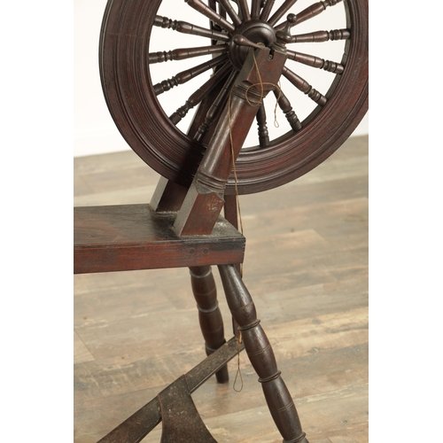 838 - A 19TH CENTURY OAK SPINNING WHEEL with raised super-structure (93cm high 83cm wide )