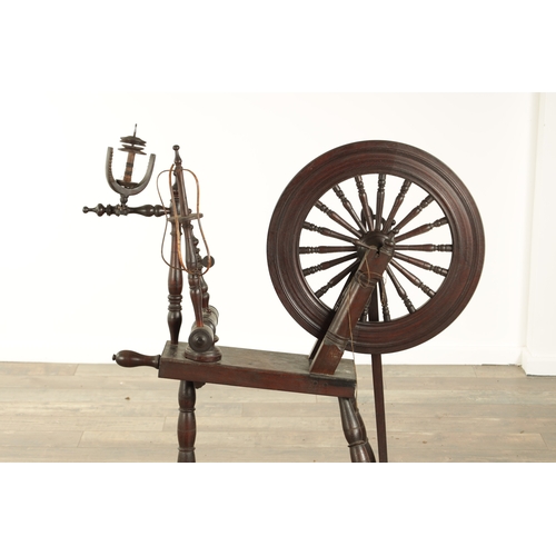 838 - A 19TH CENTURY OAK SPINNING WHEEL with raised super-structure (93cm high 83cm wide )