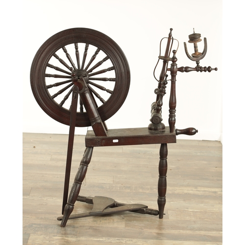 838 - A 19TH CENTURY OAK SPINNING WHEEL with raised super-structure (93cm high 83cm wide )