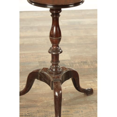 840 - A GEORGE III STYLE MAHOGANY KETTLE STAND with a circular top above a vase-turned stem and a tripod p... 